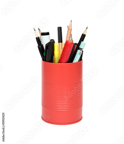 Red office pot with pencils and pens on a white background