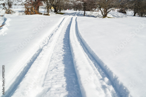 car wheel trail in the snow, ice