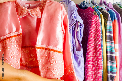 Set of clothes for kids on hangers. Shopping. © Lyudmyla V