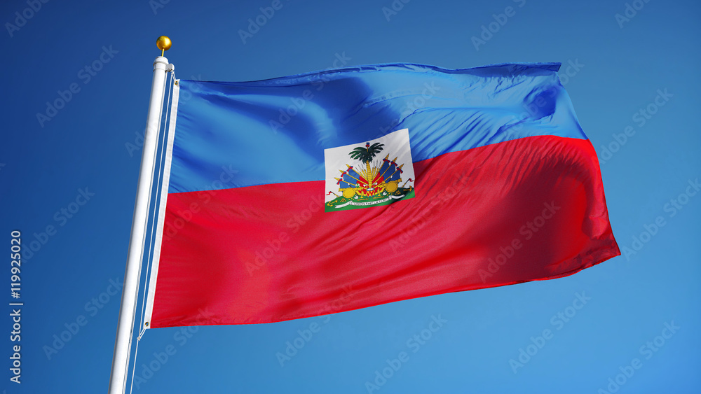 Naklejka premium Haiti flag waving against clean blue sky, close up, isolated with clipping path mask alpha channel transparency