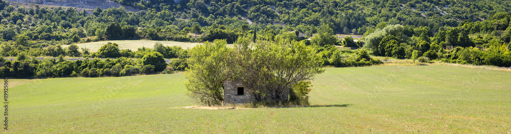 old farm house on the green field old farm house on the green field