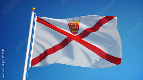 Jersey flag waving against clean blue sky, close up, isolated with clipping path mask alpha channel transparency photo