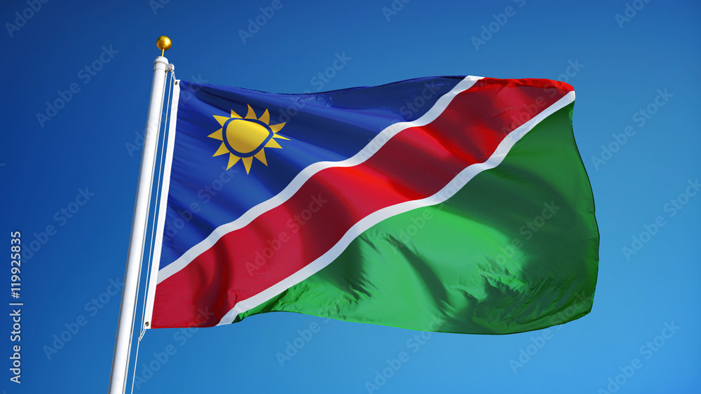 Namibia flag waving against clean blue sky, close up, isolated with clipping path mask alpha channel transparency Namibia flag waving against clean blue sky, close up, isolated with clipping path mask alpha channel transparency