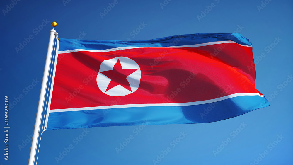 North Korea flag waving against clean blue sky, close up, isolated with clipping path mask alpha channel transparency - obrazy, fototapety, plakaty 