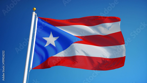 Obraz na płótnie Puerto Rico flag waving against clean blue sky, close up, isolated with clipping