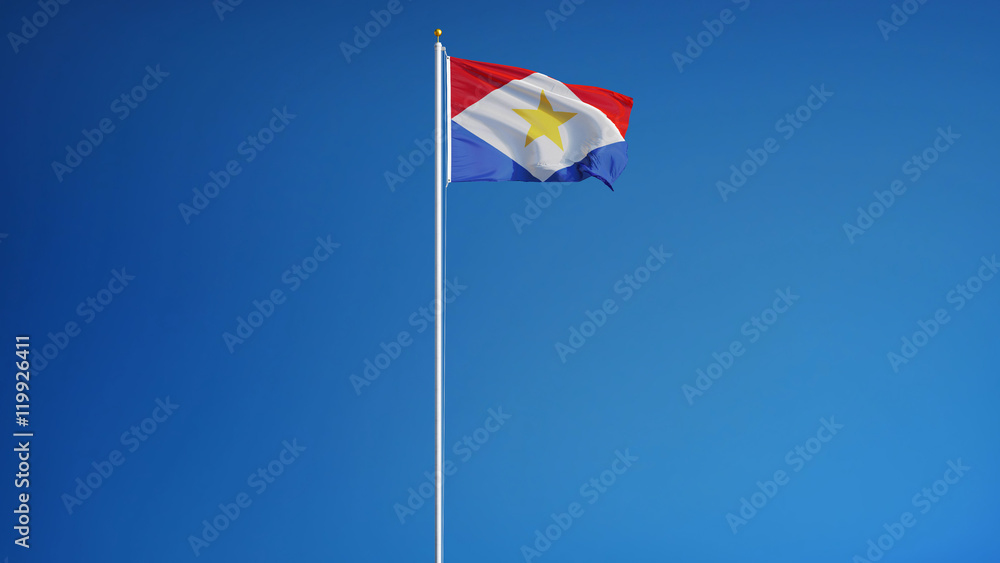 Naklejka premium Saba flag waving against clean blue sky, long shot, isolated with clipping path mask alpha channel transparency