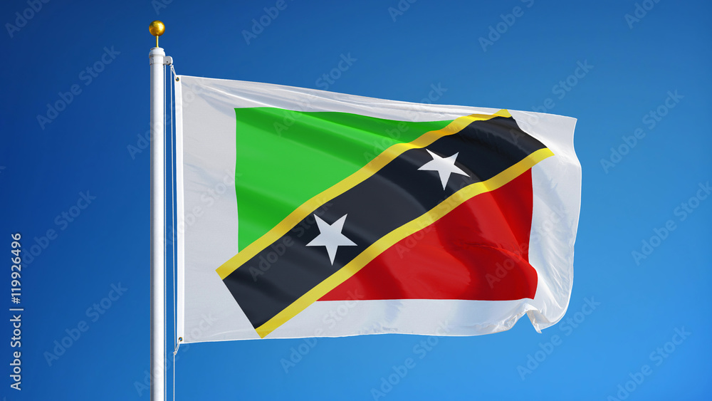 Saint Kitts and Nevis flag waving against clean blue sky, close up, isolated with clipping path mask alpha channel transparency Saint Kitts and Nevis flag waving against clean blue sky, close up, isolated with clipping path mask alpha channel transparency