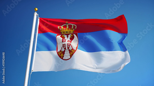 Photography Serbia flag waving against clean blue sky, close up, isolated with clipping path