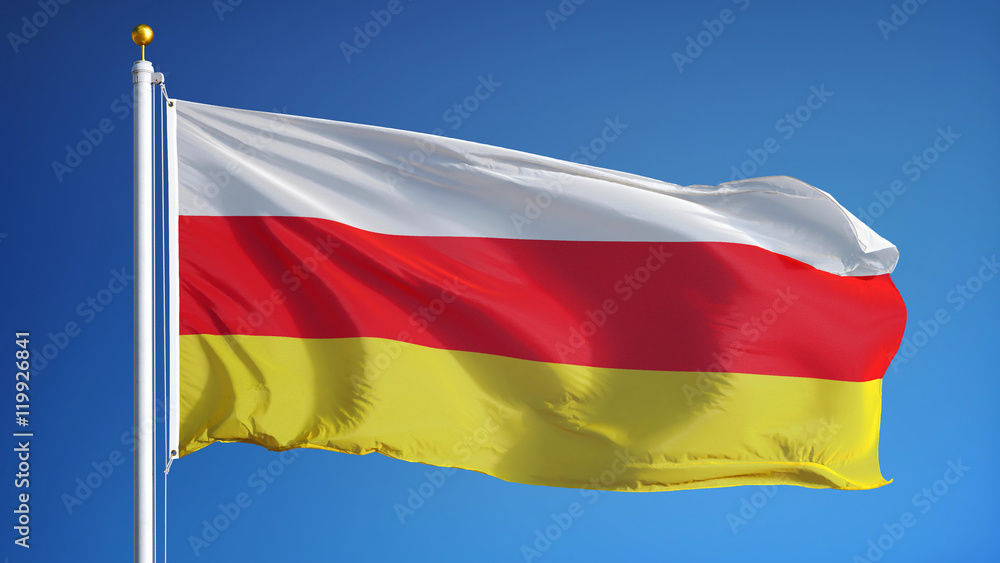 South Ossetia flag waving against clean blue sky, close up, isolated with clipping path mask alpha channel transparency South Ossetia flag waving against clean blue sky, close up, isolated with clipping path mask alpha channel transparency