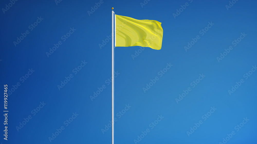 Bright yellow flag waving against clean blue sky, long shot, isolated with clipping path mask alpha channel transparency Bright yellow flag waving against clean blue sky, long shot, isolated with clipping path mask alpha channel transparency