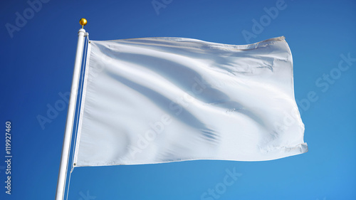 Empty white clear flag waving against clean blue sky, close up, isolated with clipping path mask alpha channel transparency photo