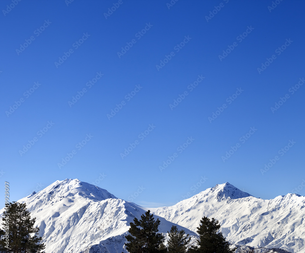 Snowy mountains and blue clear sky at nice sun morning Snowy mountains and blue clear sky at nice sun morning