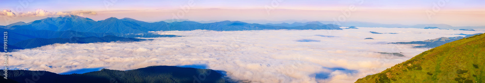 Picturesque morning in mountains, sunrise time, above clouds, Carpathians, panoramic view, Ukraine.