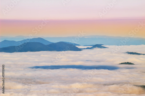 Picturesque sunrise morning in mountains above clouds  Carpathians  Ukraine.