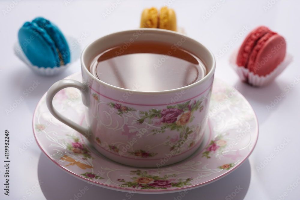 macaroon and tea on a white background macaroon and tea on a white background