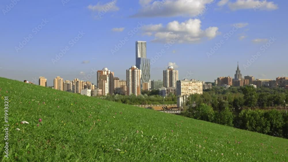 Unrecognizable man having rest in city park against Moscow urbanscape. 4K shot Unrecognizable man having rest in city park against Moscow urbanscape. 4K shot