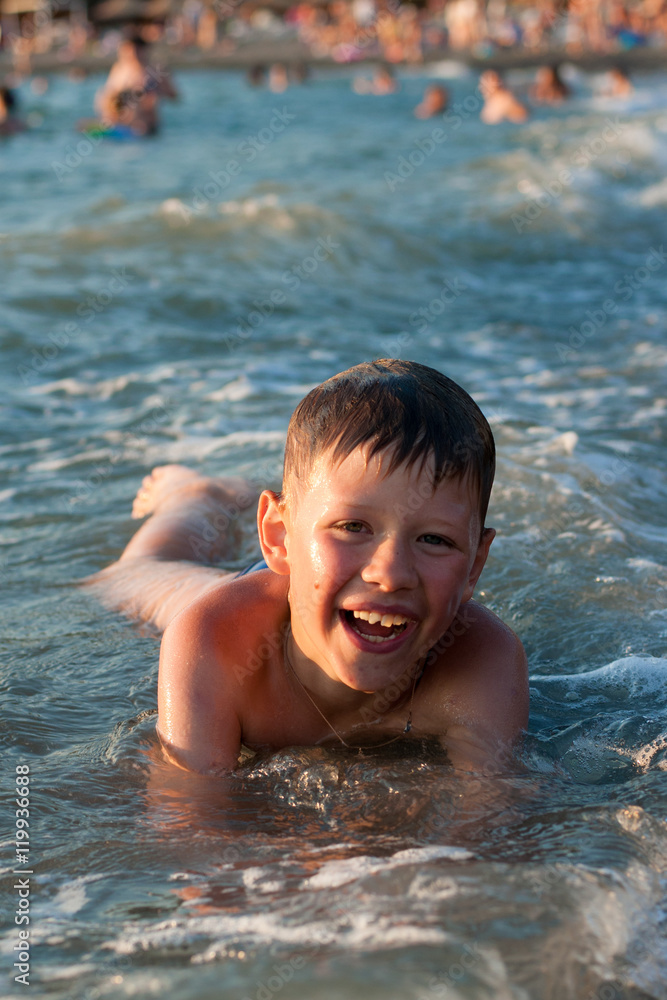 Boy bathing in the sea