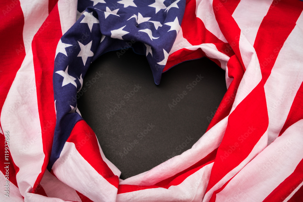 Fototapeta premium Heart shape American flag on black background .