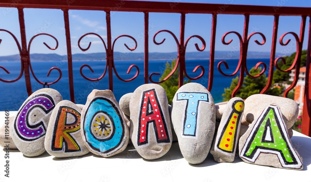 Fototapeta premium croatia word written on the painted stones on the terrace