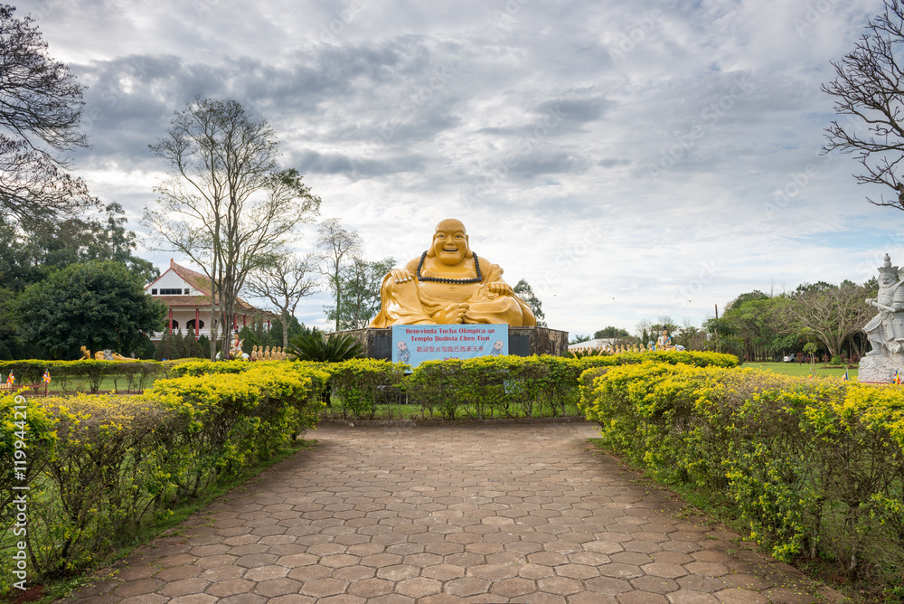 Giant Buddha statue in the gardens of the temple