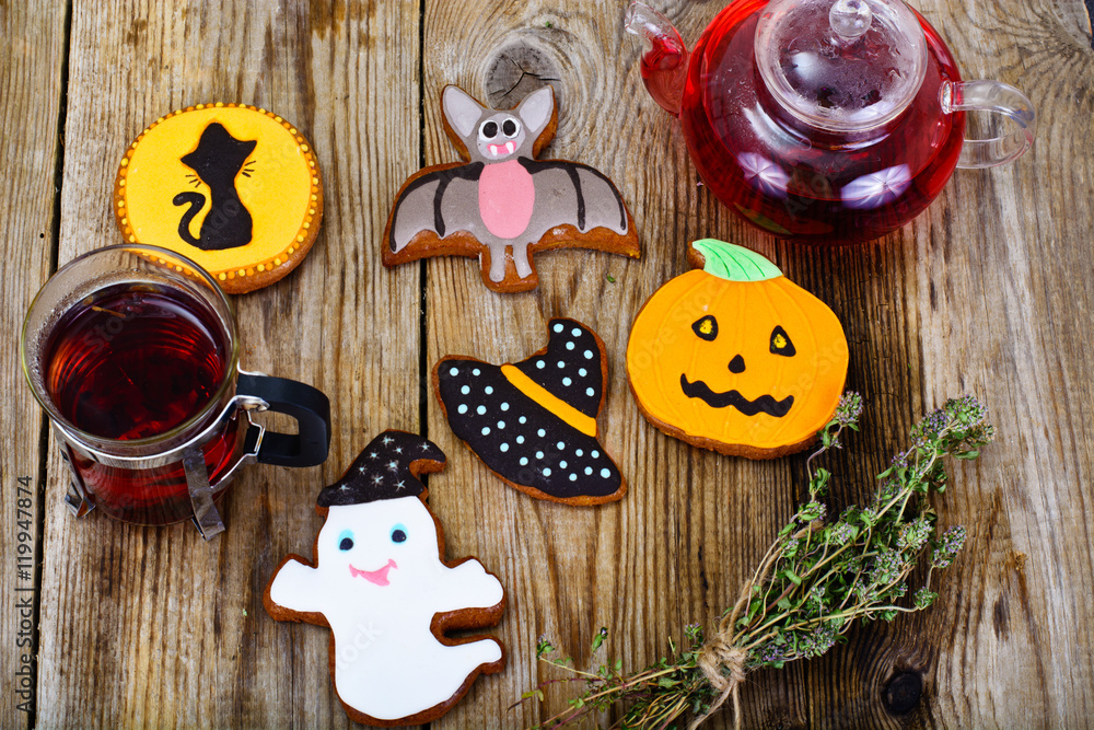 Gingerbread for Halloween with Red Tea. Funny Holiday Food Gingerbread for Halloween with Red Tea. Funny Holiday Food