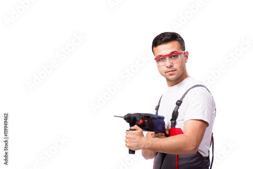 Young repairman with drill perforator isolated on white