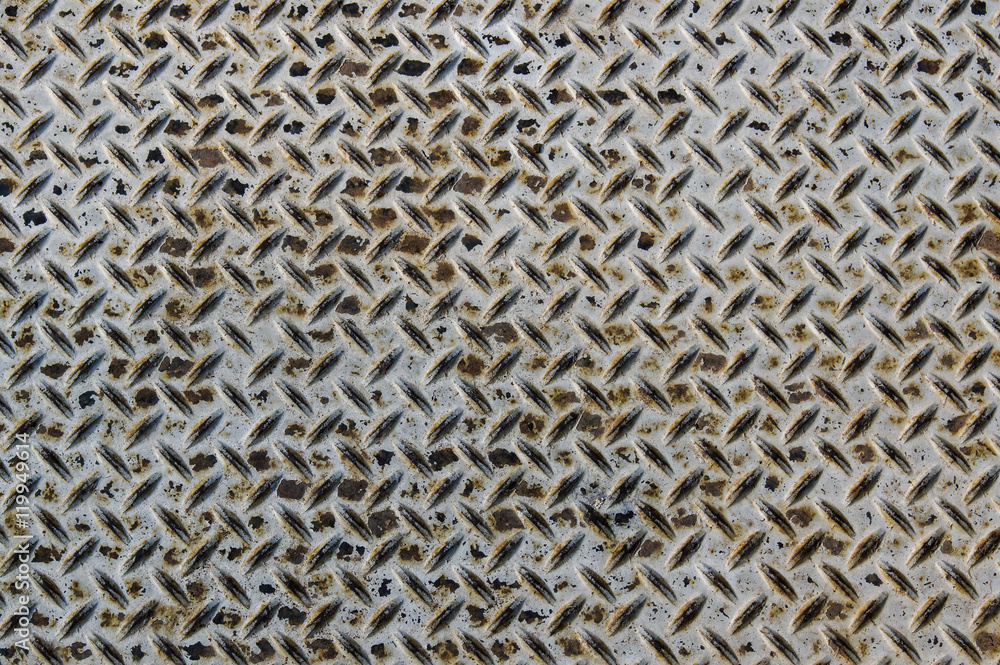 Worn diamond plate metal with rust Worn diamond plate metal with rust