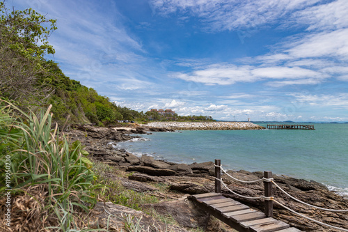 Sea and beach under cloud and blue sky