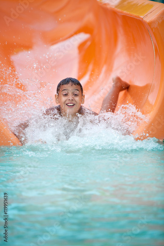 Funny excited child enjoying summer vacation in water park © V&P Photo Studio