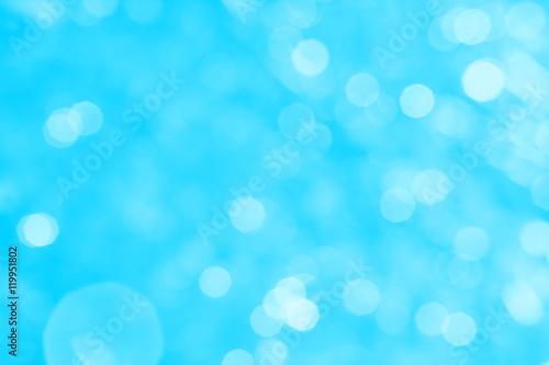 Abstract blue background with white bokeh