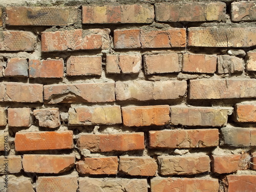 Abandoned red brick masonry grunge background