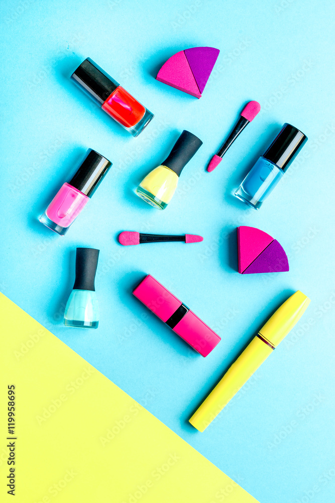 concept cosmetic set on blue and yellow background top view concept cosmetic set on blue and yellow background top view
