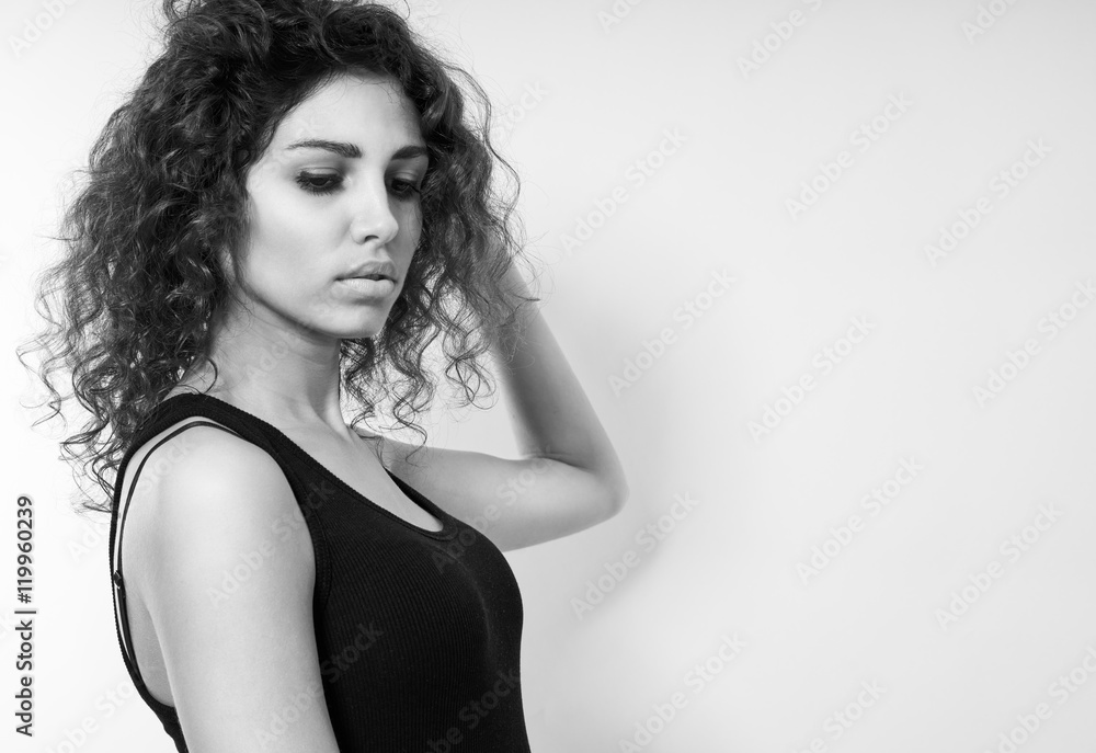 Fototapeta premium Young woman pose with curly hair