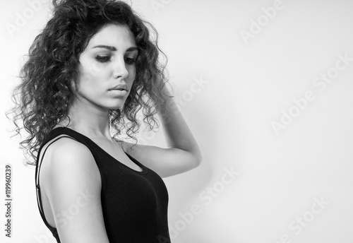 Young woman pose with curly hair