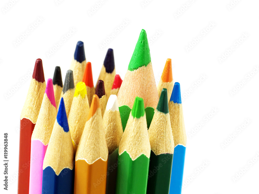 Set of color pencils on white background, macro, shallow depth of field, focus on the biggest pencil