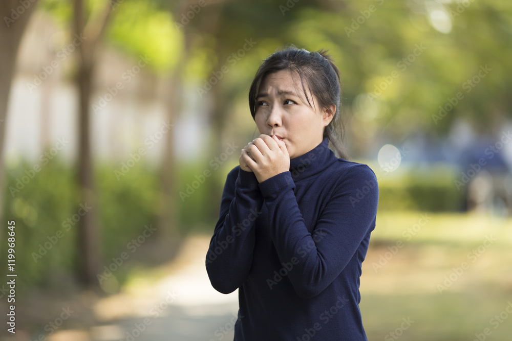 Health Care: Woman feel cold at park Health Care: Woman feel cold at park