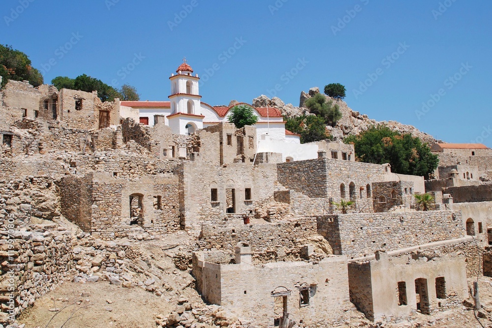 The church of Agia Zoni stands among the ruins of the abandoned village of Mikro Chorio on the Greek island of Tilos.