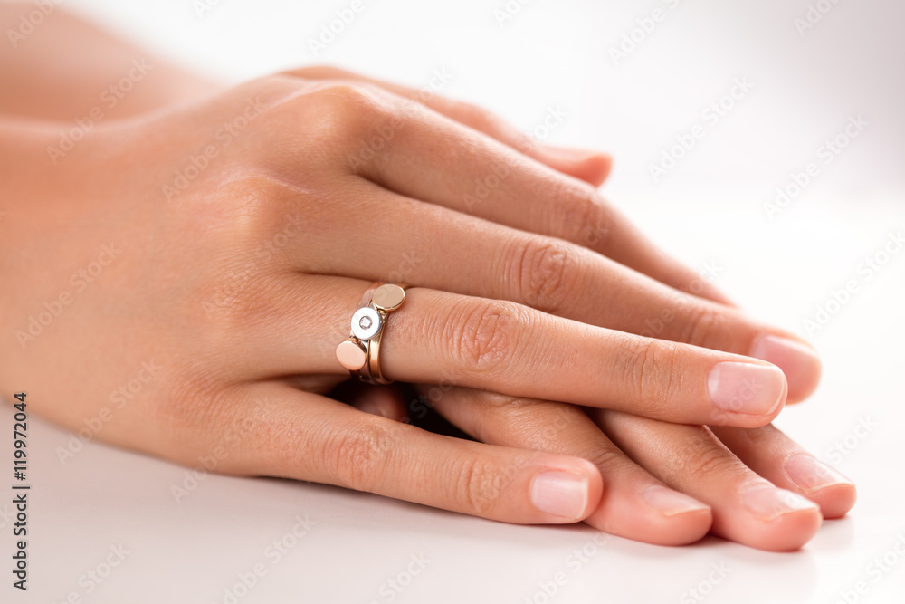 Three puzzle rings in three colors (gold, silver, bronze) on han Three puzzle rings in three colors (gold, silver, bronze) on han