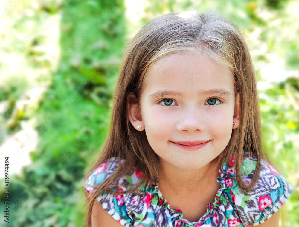 Portrait of adorable smiling little girl in summer day Portrait of adorable smiling little girl in summer day