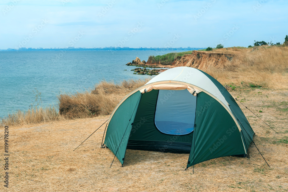 Modern tourist tent near sea