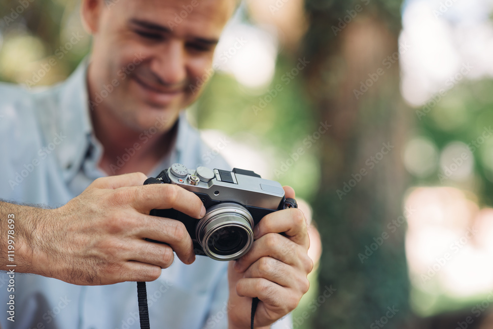 Photographer watching his pictures