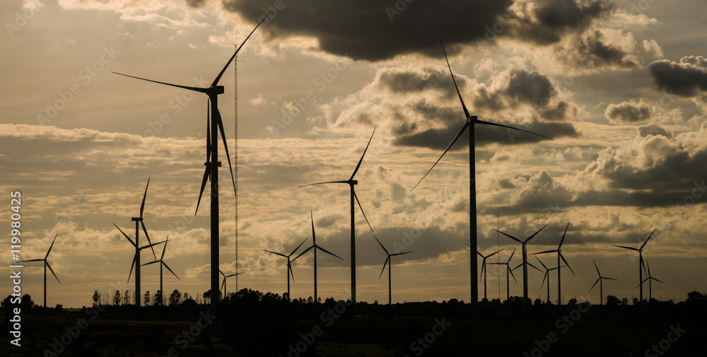 Wind turbine farm on hillside StockFoto Adobe Stock