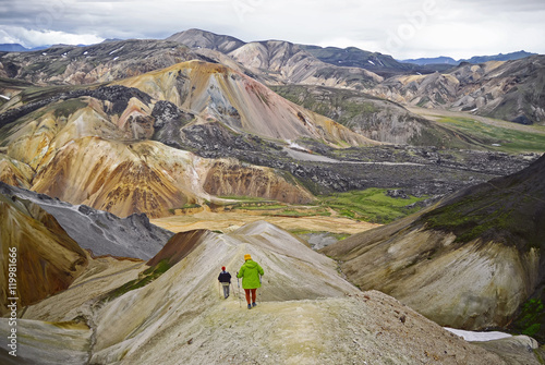 Group of hikers in the mountains . Icelandic landscape -  view  on   amazing  valley National Park Landmannalaugar    photo