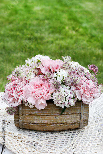 Floral arrangement with pink carnations © agneskantaruk