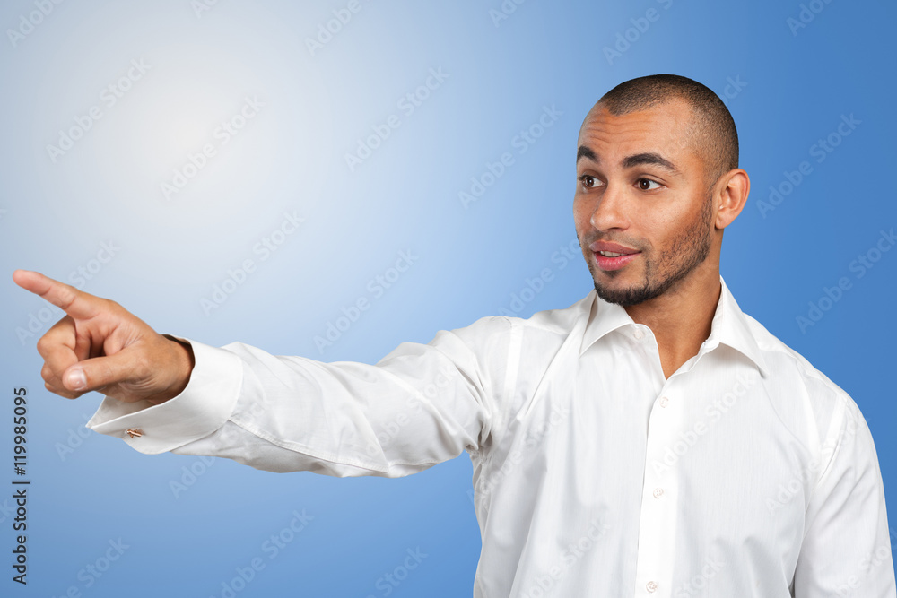 Happy successful businessman pointing on copy space Happy successful businessman pointing on copy space