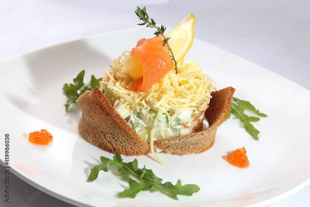 Russian salad with smoked salmon and toast Russian salad with smoked salmon and toast
