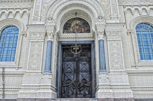 Kronstadt, Russia. The architectural fragment of the Naval cathedral of Saint Nicholas in winter. The icon, the door and the anchor above it.