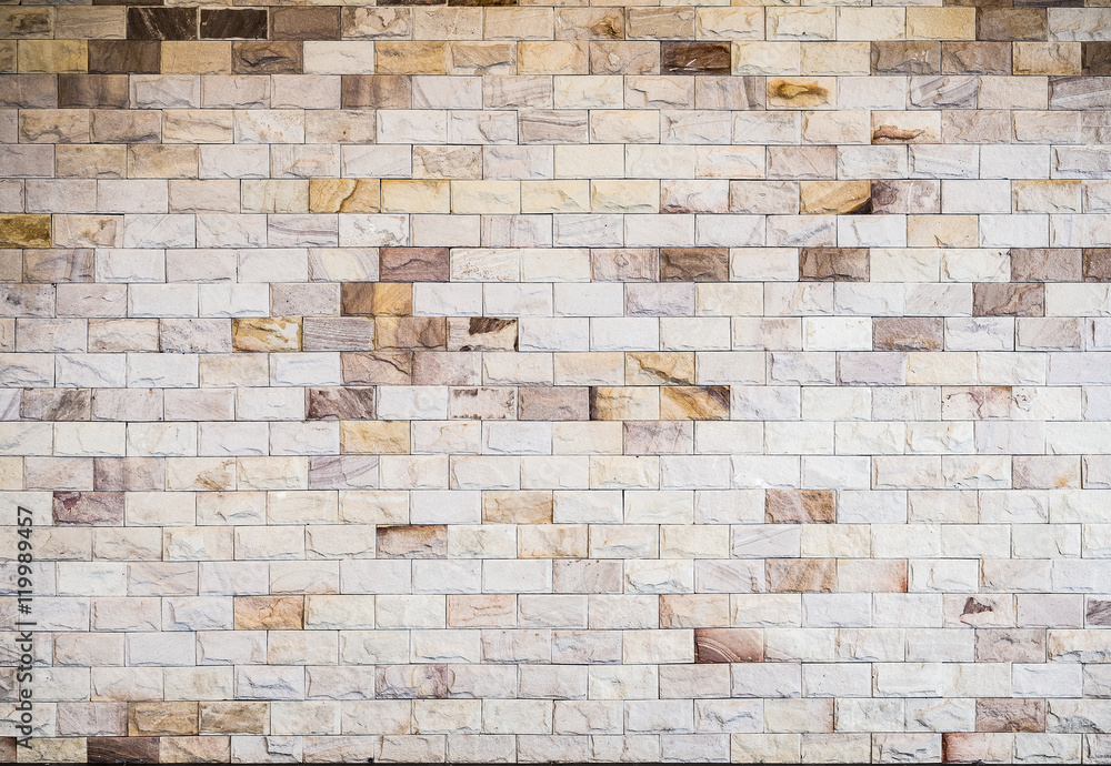 Obraz premium small yellow bricks on the wall, texture