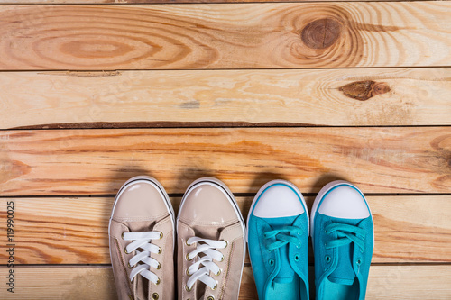 shoes on brown wooden floor standing in line