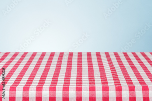  table covered with checkered tablecloth